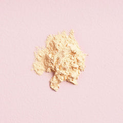 W7 powder pot held in hand showing compact size and travel convenience