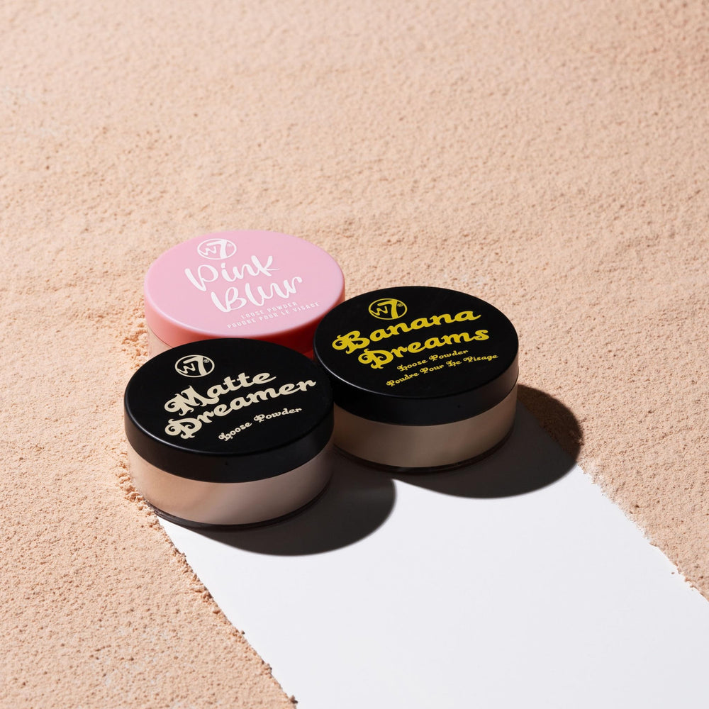W7 trio packed in makeup bag beside mirror, on-the-go touch-up benefit