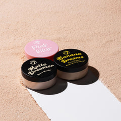 W7 trio packed in makeup bag beside mirror, on-the-go touch-up benefit