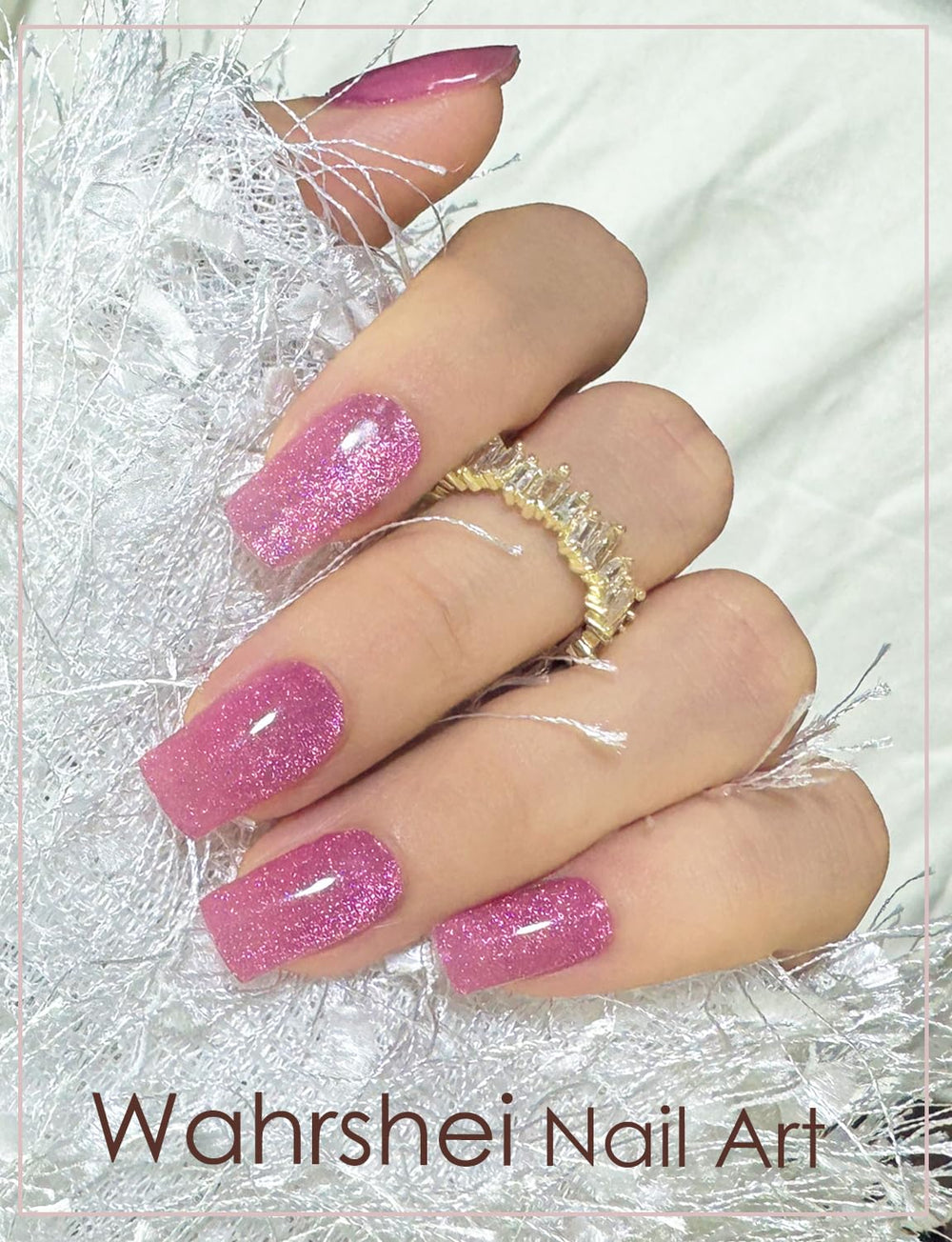 Hand wearing Wahrshei plum cat eye sticker cured under lamp showing shimmer benefit