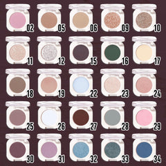 WanTuoluo swatch on brush showing holographic plum payoff and buildability