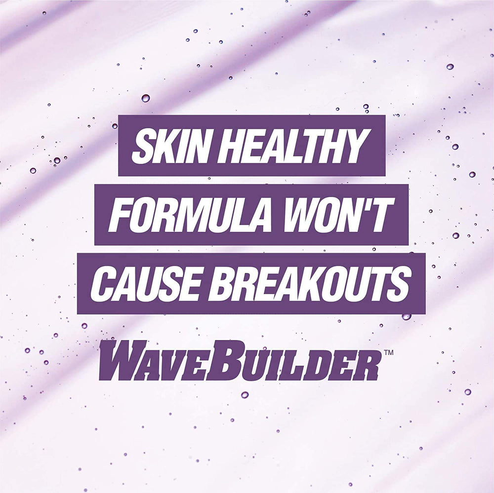 Applying WAVEBUILDER pomade while brushing to form deep, defined waves