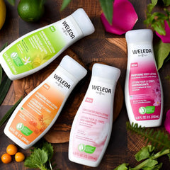 Weleda bottle in hand for scale showing compact travel-friendly size