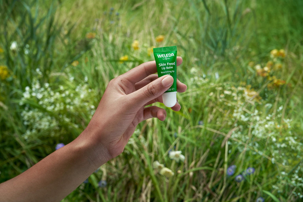 Weleda lip butter applied to lips demonstrating instant softness and subtle gloss