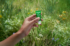 Weleda lip butter applied to lips demonstrating instant softness and subtle gloss