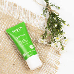 Weleda Skin Food applied to back of hand demonstrating smoothing and quick comfort