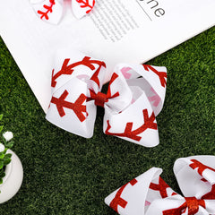 Whaline bow worn in a ponytail demonstrating secure fit and playful game-day style