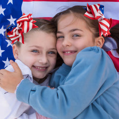 Whaline bow paired with patriotic outfit showing coordinated event styling