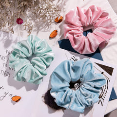 Whaline pastel scrunchie holding a ponytail with gentle grip