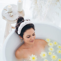 WHAVEL model wearing headband while washing face for hair protection benefit