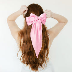 WHAVEL pink bow side profile highlighting satin sheen and neat silhouette