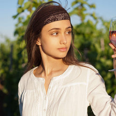 WILLBOND headband held in hand to show compact size and portability
