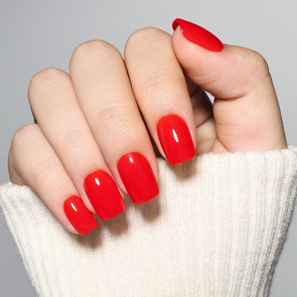WiniBeauty lifestyle image of woman wearing red nails for a bold finishing touch