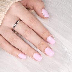 WiniBeauty hand wearing short square pink nails for a polished everyday look