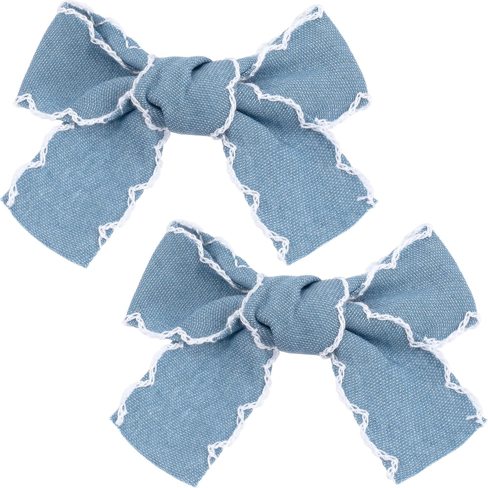 Winsyison front view of two light blue denim bow clips showing vintage lace edges and pretty finish