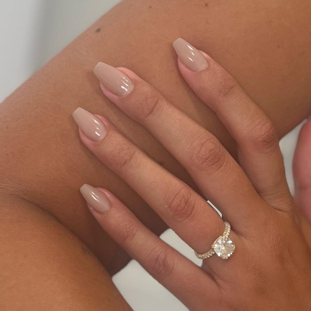 XCREANDO front packaging showing beige coffin press-on nails and included accessories