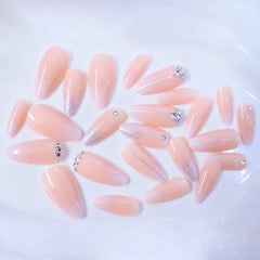 Xenophoer swatch of almond profile on nail tip, demonstrates shape and natural finish benefits