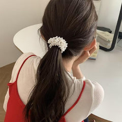Xiangwenlan scrunchie on model with dressy outfit showing elevated accessory benefit