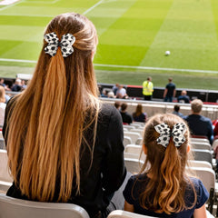 XIELIME bow worn in ponytail on a player demonstrating visible game-day accent and comfort