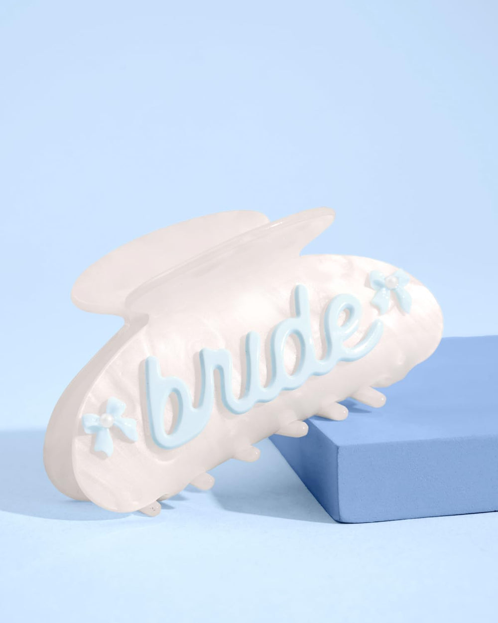 xo, Fetti close-up of blue bows and pearls, delicate decorative detail for photos