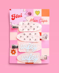 xo, Fetti clips on tabletop with bridal items showing celebration-ready styling