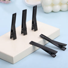 YAKA clip attached to a handmade hairbow demonstrating craft-friendly fastening