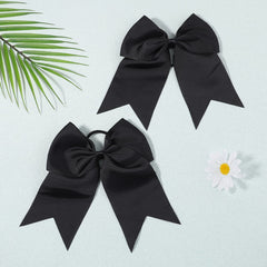 YHXX YLEN bow beside a hand to show eight-inch size and scale