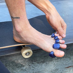YogaToes Gems for Men pictured on male feet after workout supporting recovery