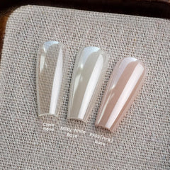 YOKE FELLOW jar next to fingers showing scale and portable salon convenience