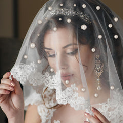 Yolev bridal updo with pearl pins in hair demonstrating secure, decorative hold