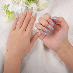 Yolev metal nail ring holding a press-on nail, illustrates quick on-and-off wear
