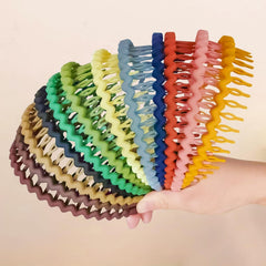 YONOY front view of 12-pack headbands showing slim matte colors and tidy packaging benefit