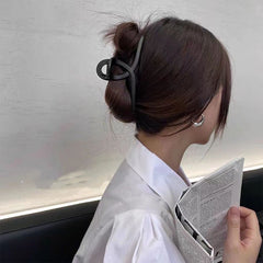 YOOOYOOO clips held in hand to show scale and lightweight comfort benefit