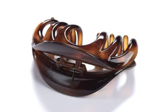 YOUXUAN coffee clip in-use updo illustrating strong hold for thick hair