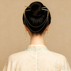 Zaxomum hair sticks styled in a bun securing updo with stylish accents