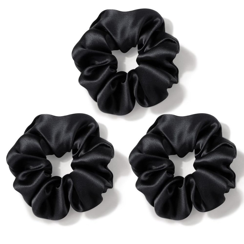 Zenssia front view of three black silk scrunchies showing elegant presentation and protection