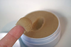 Applying Zero Shine with fingertips onto scalp area - maintains natural look