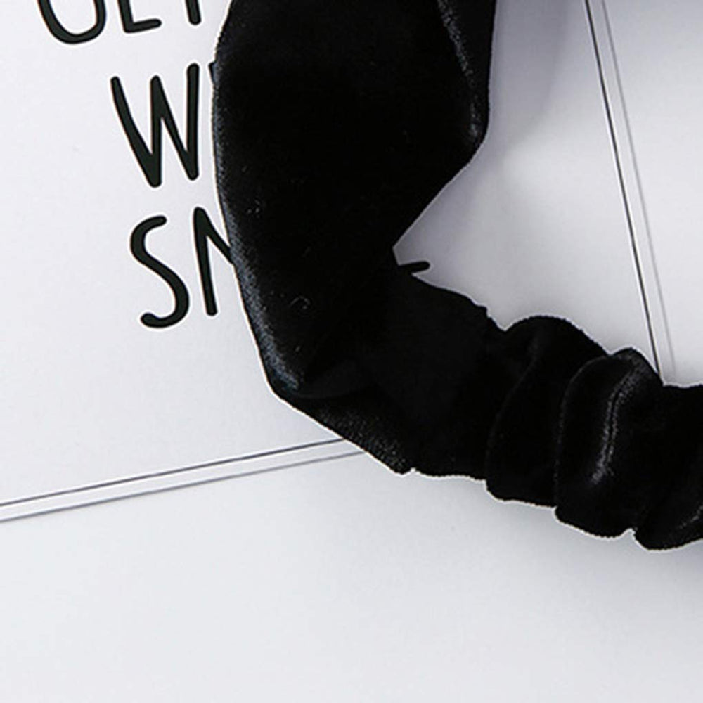 Ziper headband next to ruler showing compact size and wearable scale