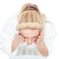 Zkptops headband on vanity with skincare items suggesting organized routine