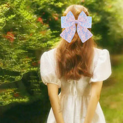 ZOONAI bow worn in baby's hair showing photogenic look and comfort