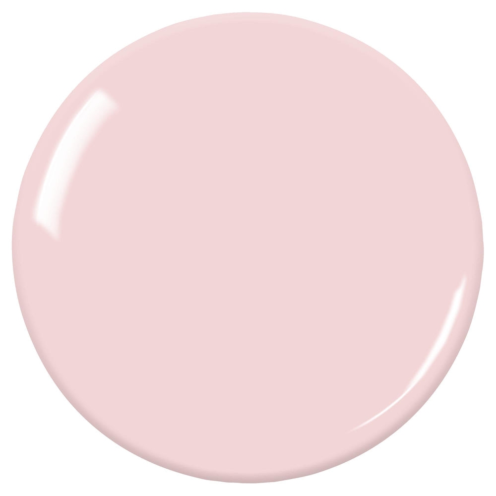 ZOYA Bela swatch on fingernails showing sheer milky pink for a natural look