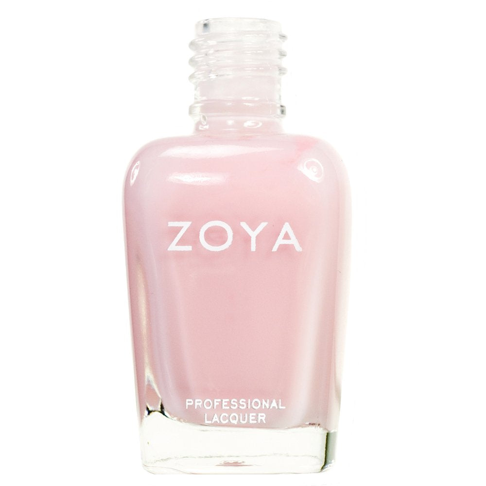 ZOYA Madison lifestyle on coffee table showcasing elegant neutral manicure for everyday wear