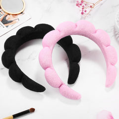 Ztomine headband on hand size comparison showing compact stretch-fit benefit