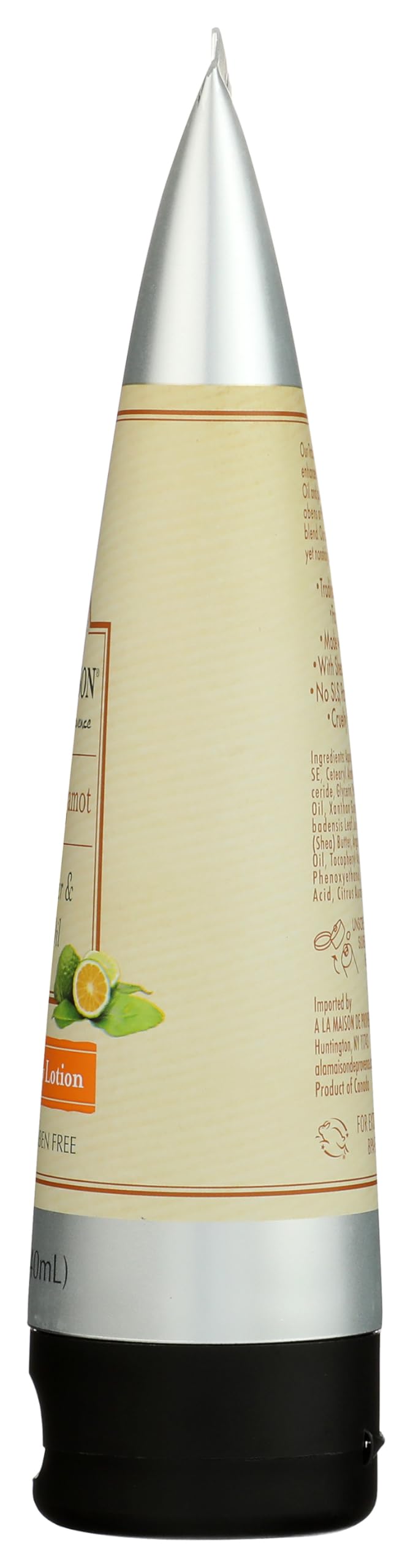 A LA MAISON bottle with fresh oranges and bergamot highlighting natural citrus fragrance