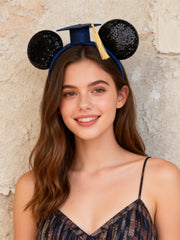 A Miaow bow detail showing glitter fabric and secure stitching benefit