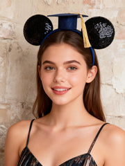 A Miaow mini graduation cap with tassel emphasizing celebratory accent