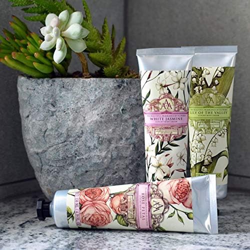 AAA DE AROMAS Artesanales de Antigua jar in a handbag lifestyle shot showing everyday accessibility