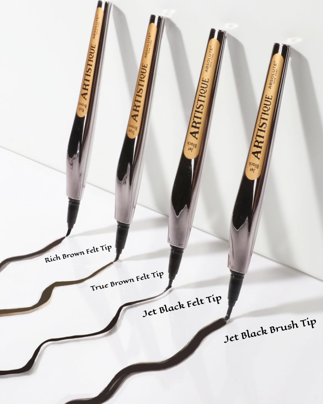 Absolute New York jet black swatches on skin demonstrating intense pigment and waterproof finish