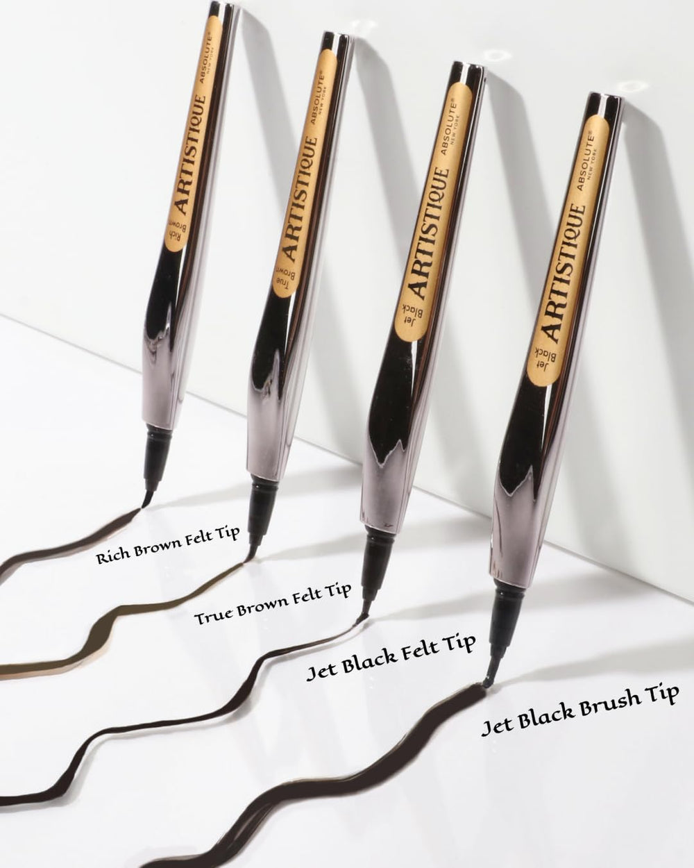 Absolute New York jet black swatches on skin demonstrating intense pigment and waterproof finish