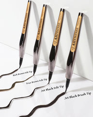 Absolute New York jet black swatches on skin demonstrating intense pigment and waterproof finish